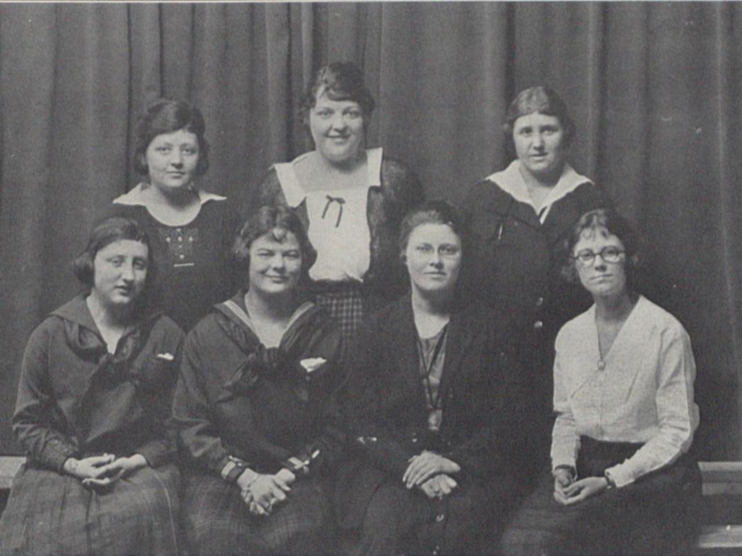 A black and white photo of seven female students in 1922
