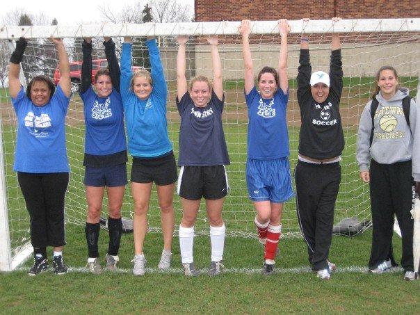 Lori Johnson-Vegas' intramural soccer team poses in the goal