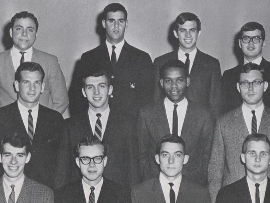 A black and white photo of 12 male students