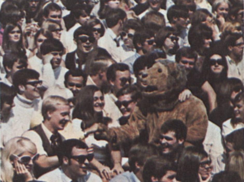 A photo of the crowd in the football stands, with the Nittany Lion in the center