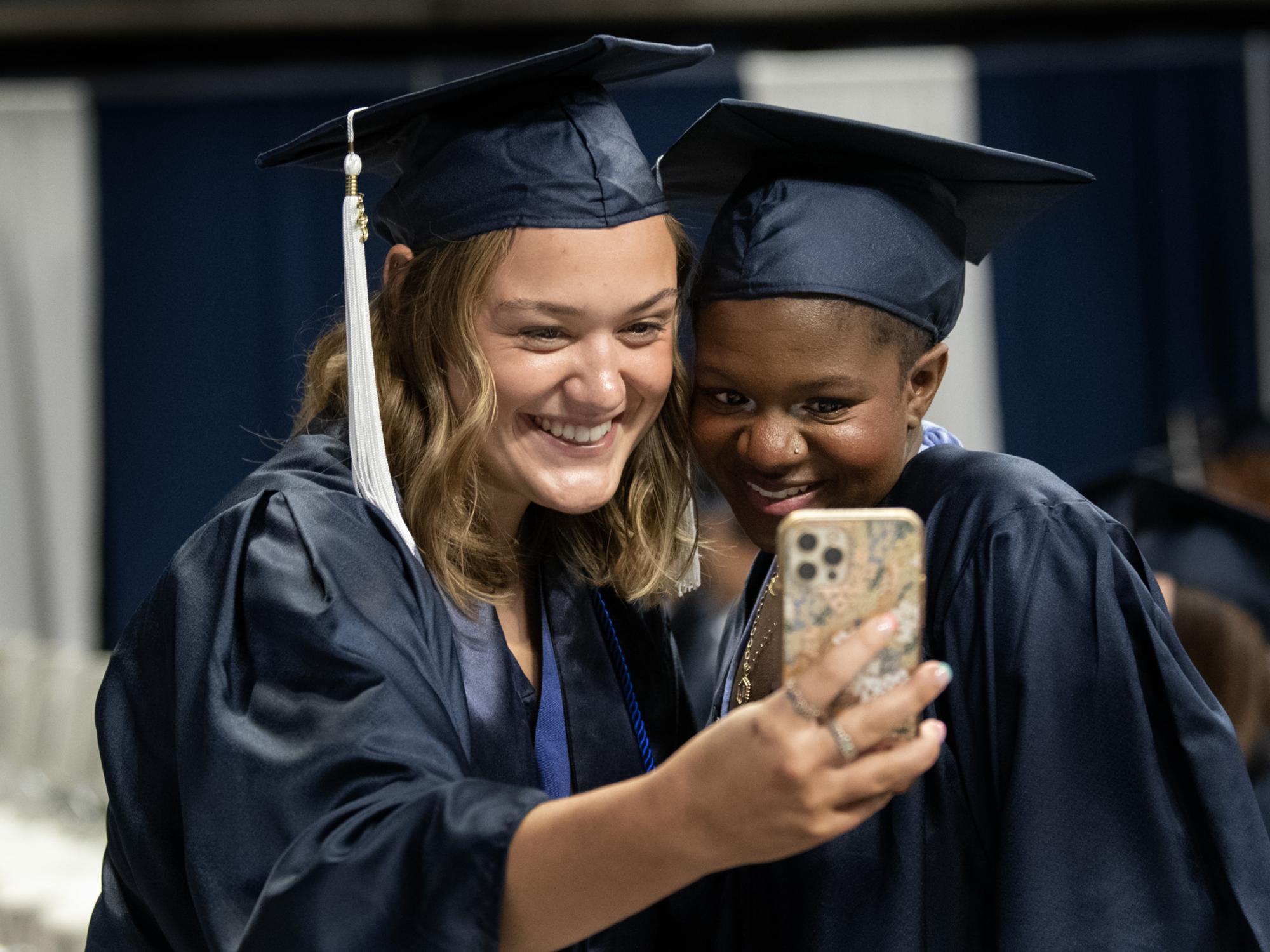 graduates taking a selfie before commencement