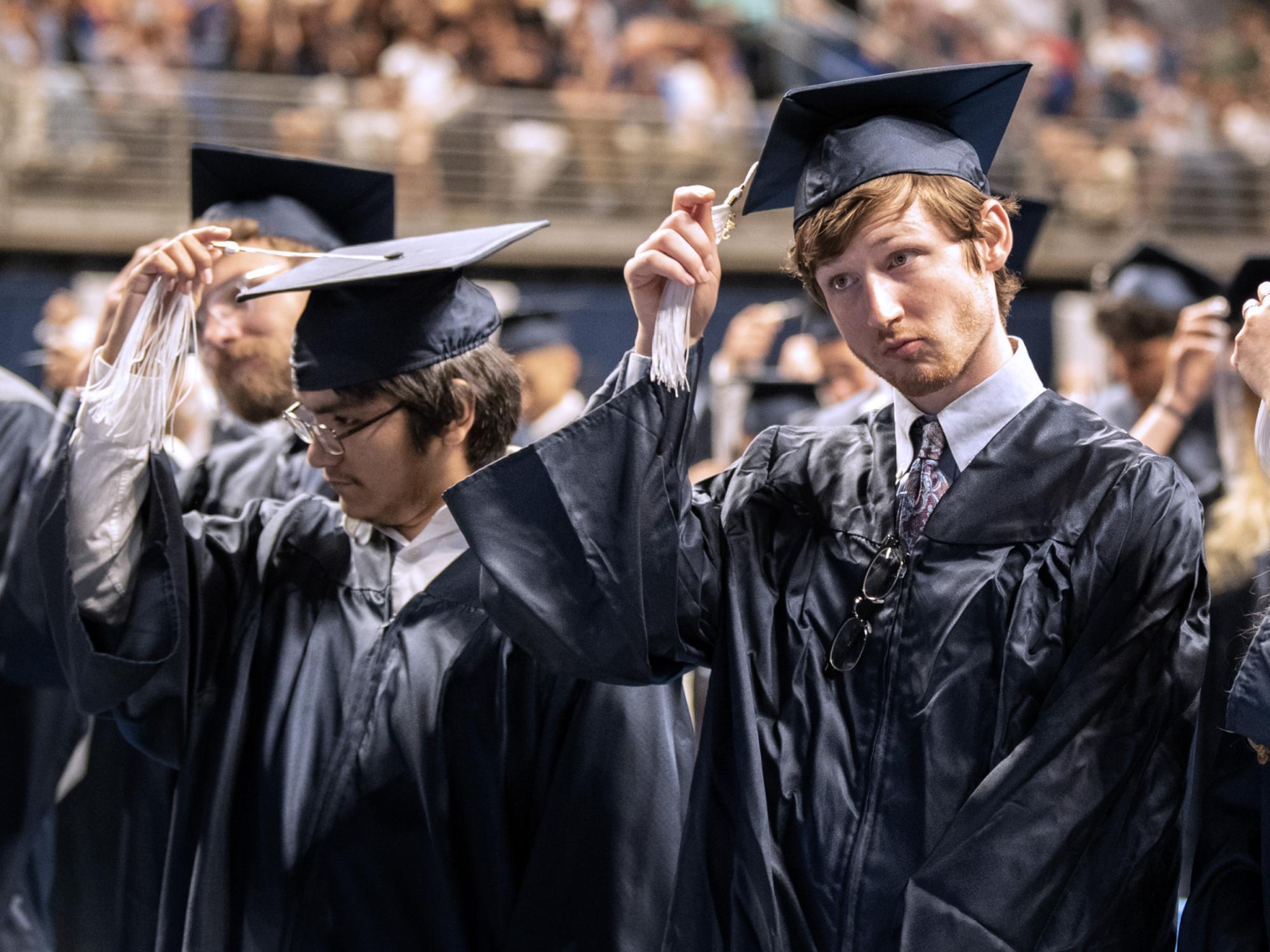 turning tassels at graduation ceremony