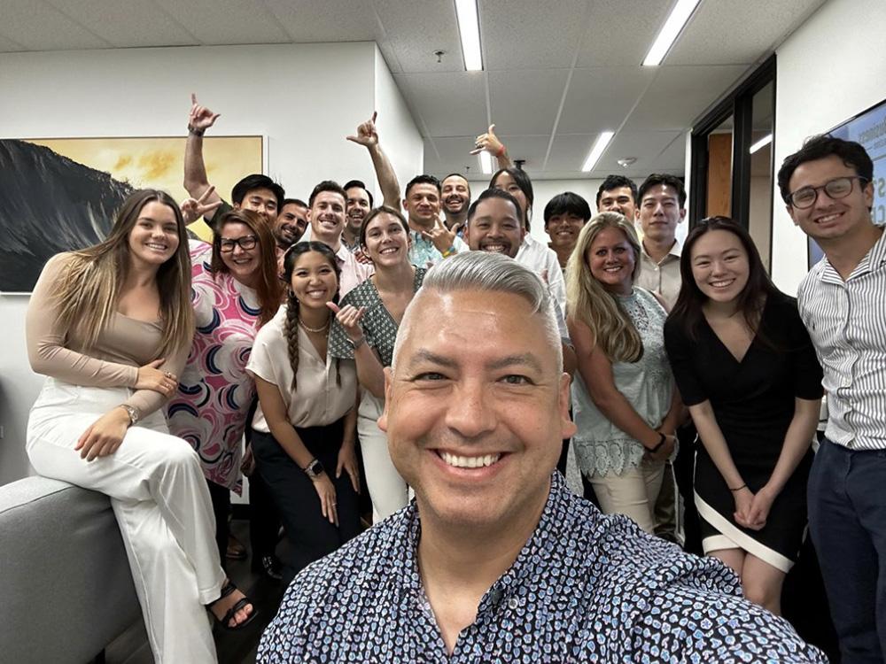 Group picture of the entire Northwestern Mutual office staff during a “Pau Hana.”