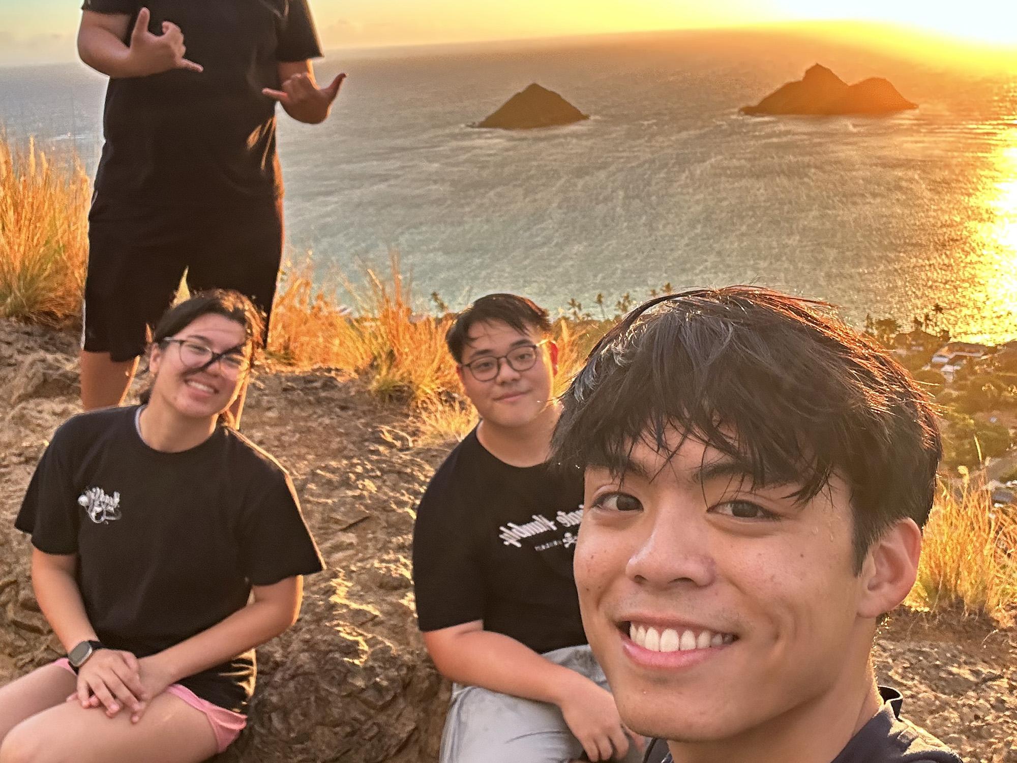 Emil and some of the other interns participating in an early morning intern bonding sunrise hike on top of the Lanikai Pillbox Hike located in Kailua, Hawaii.