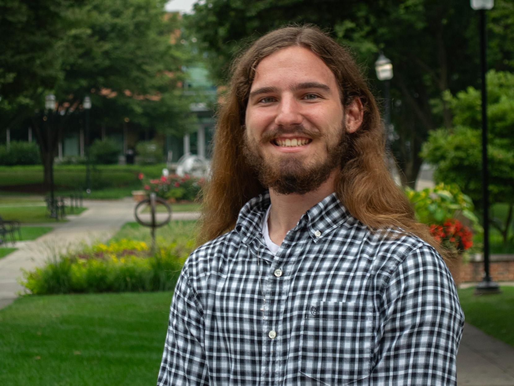 Fabian Vantassell stands on the Penn State Harrisburg campus
