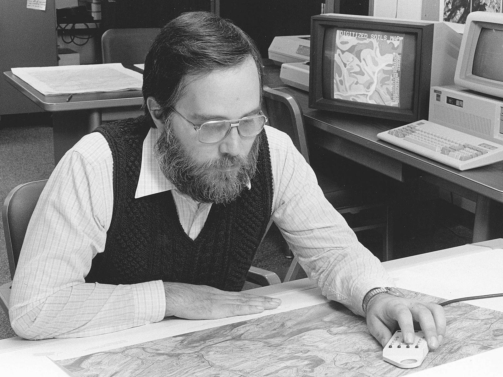 man digitizing a map by hand