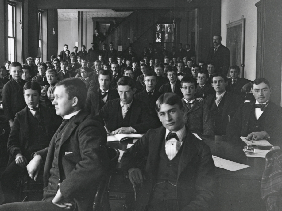 A black and white photo of a group of male students