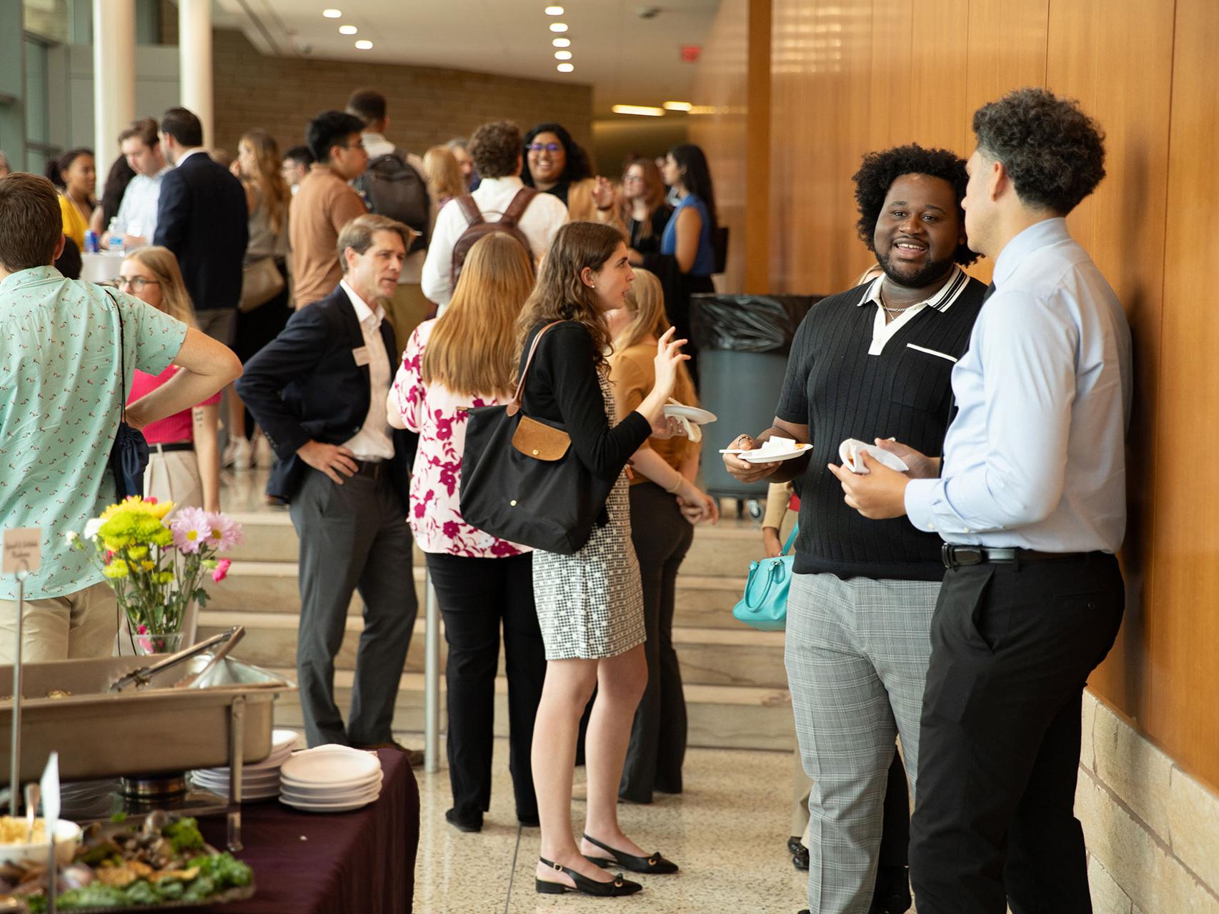 Law students mingling with faculty and staff during 2023 orientation at Penn State Law in University Park.