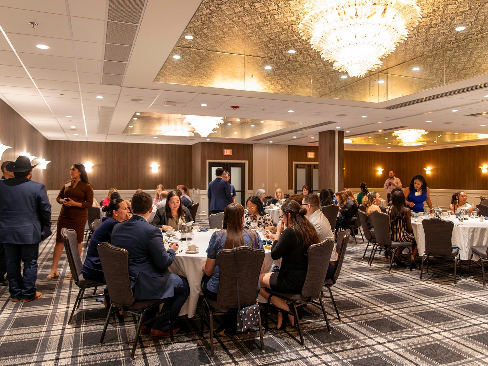 Penn State Law students, faculty, and staff mingle during the 2023 Minority Mentor Program reception.