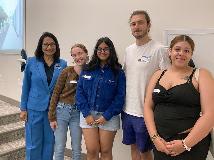 Dr. Bendapudi stands at left with a group of students