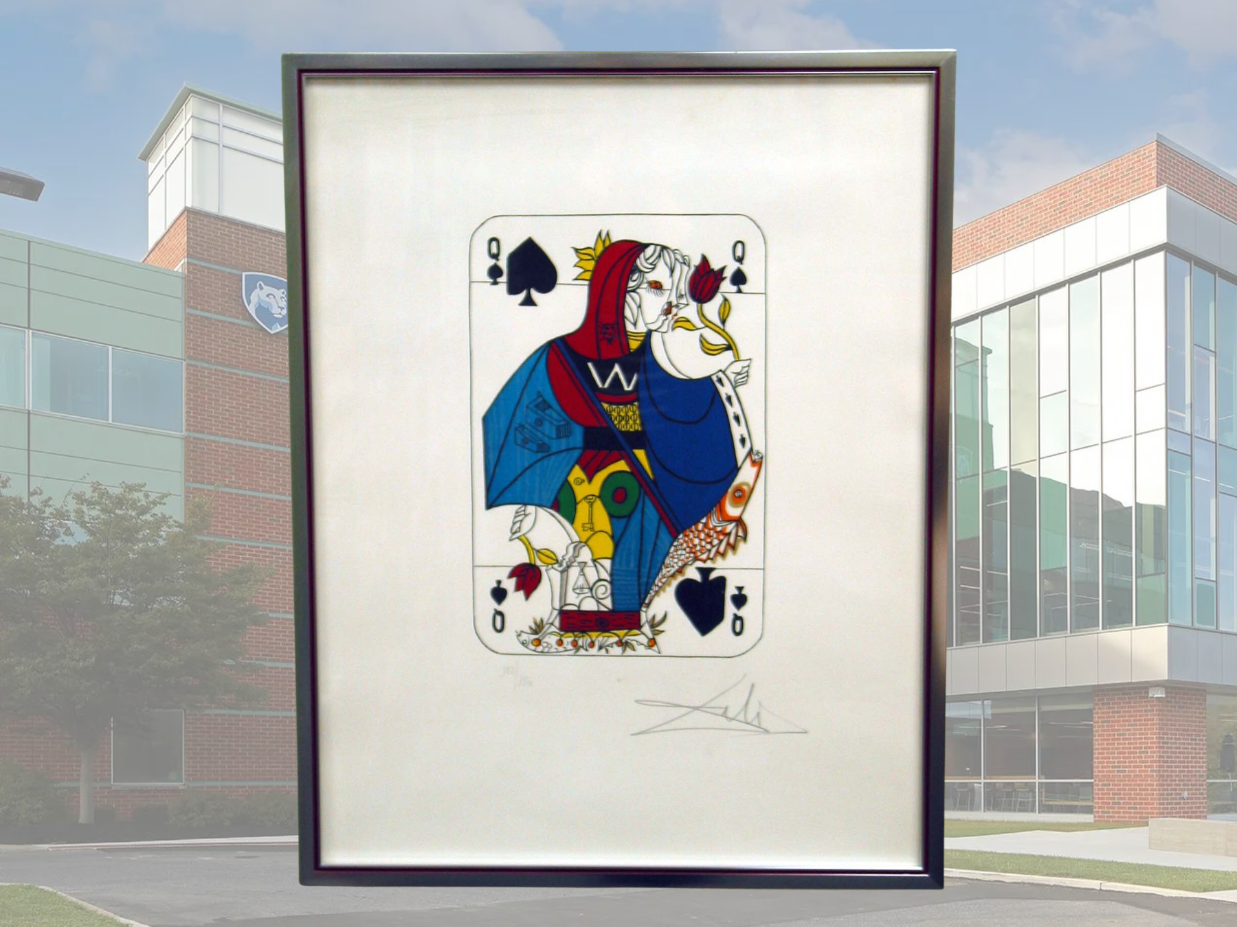 A framed photo of Salvadore Dali's piece, "Queen of Spades"