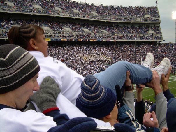 Lori Johnson-Vegas is tossed by members of the student section after a Penn State touchdown during a football game at Beaver Stadium.