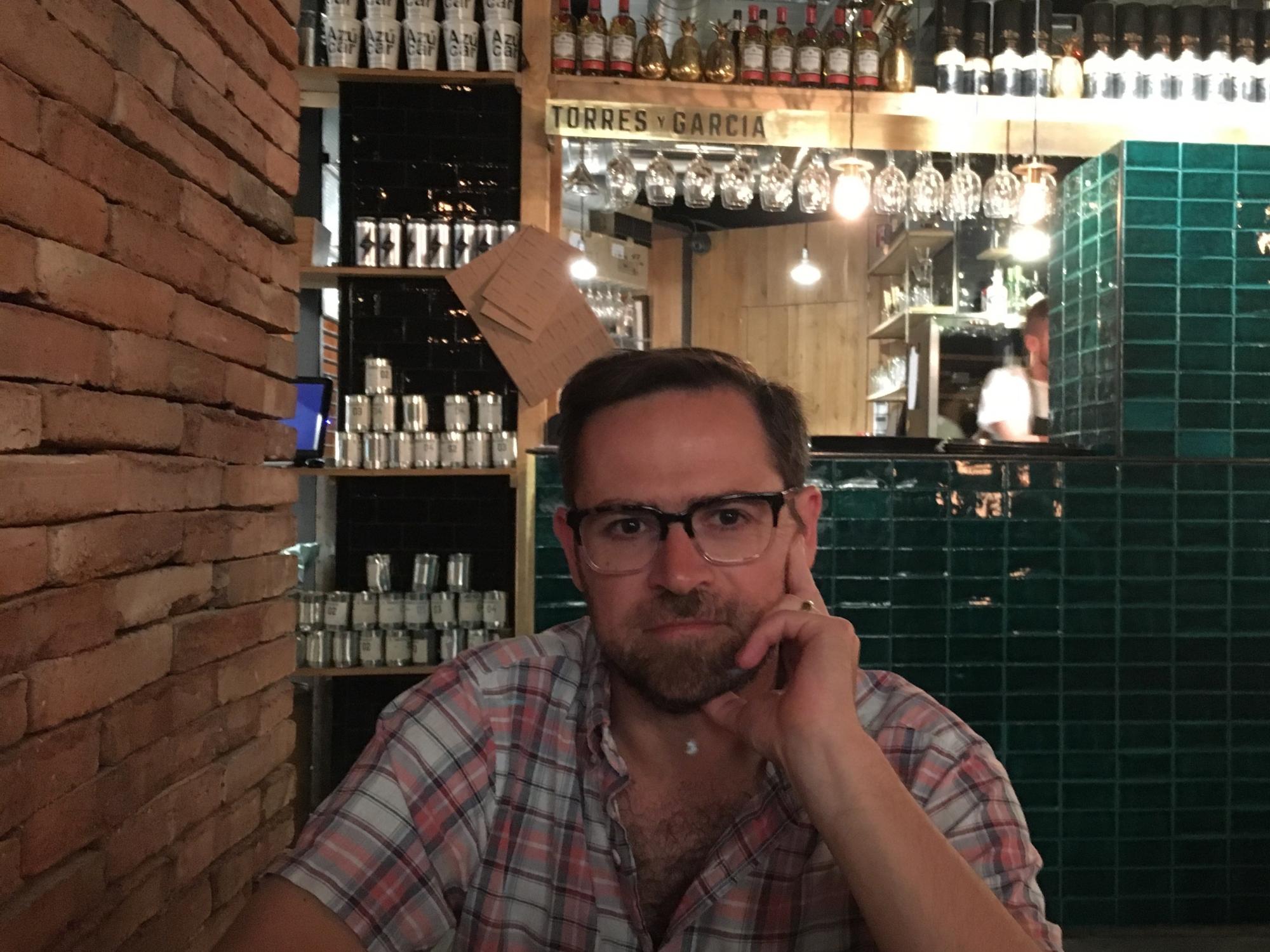 Image of Burleigh Hendrickson sitting in restaurant 