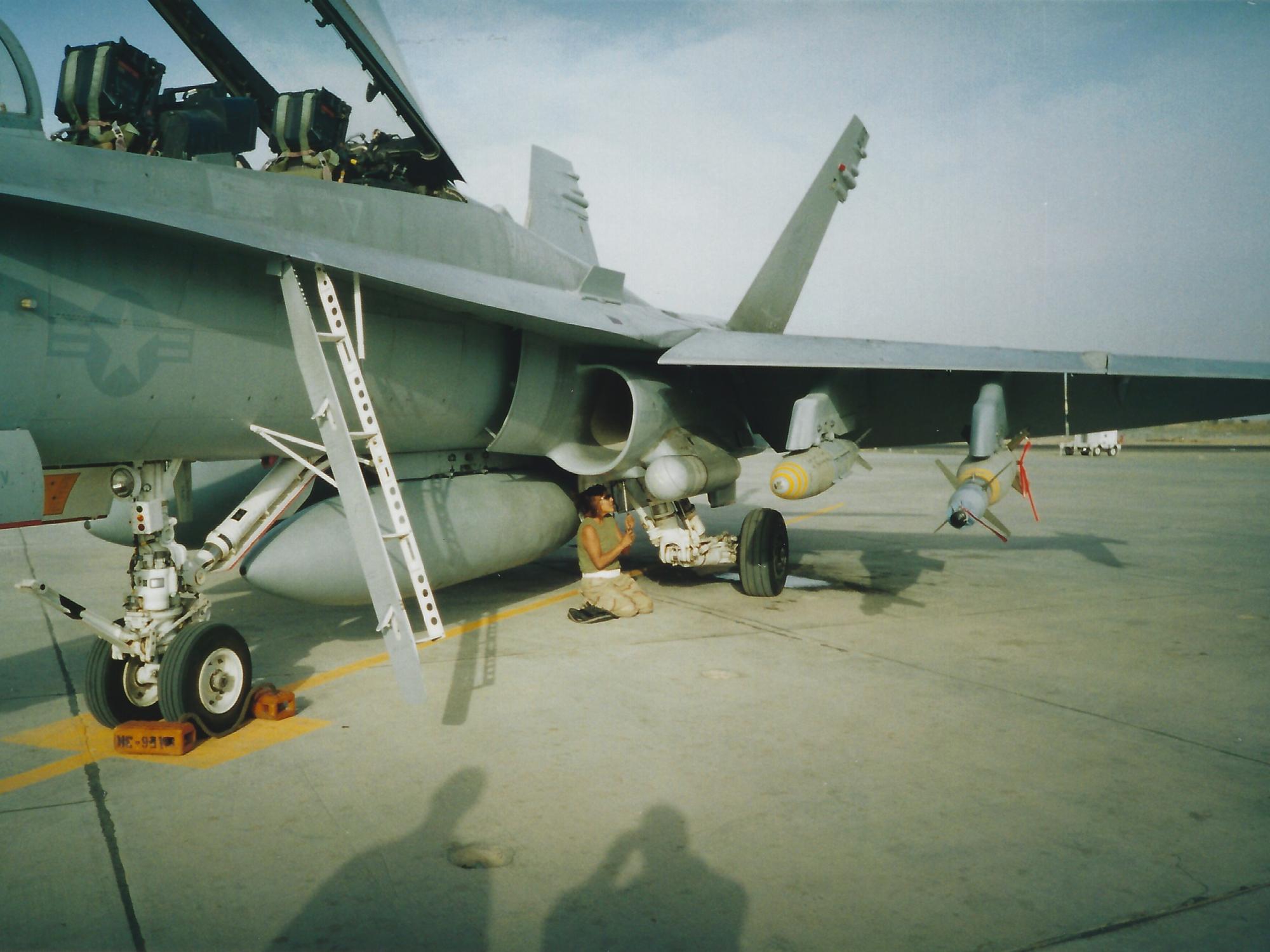 Fredericks working on an aircraft on her deployment in Kuwait.
