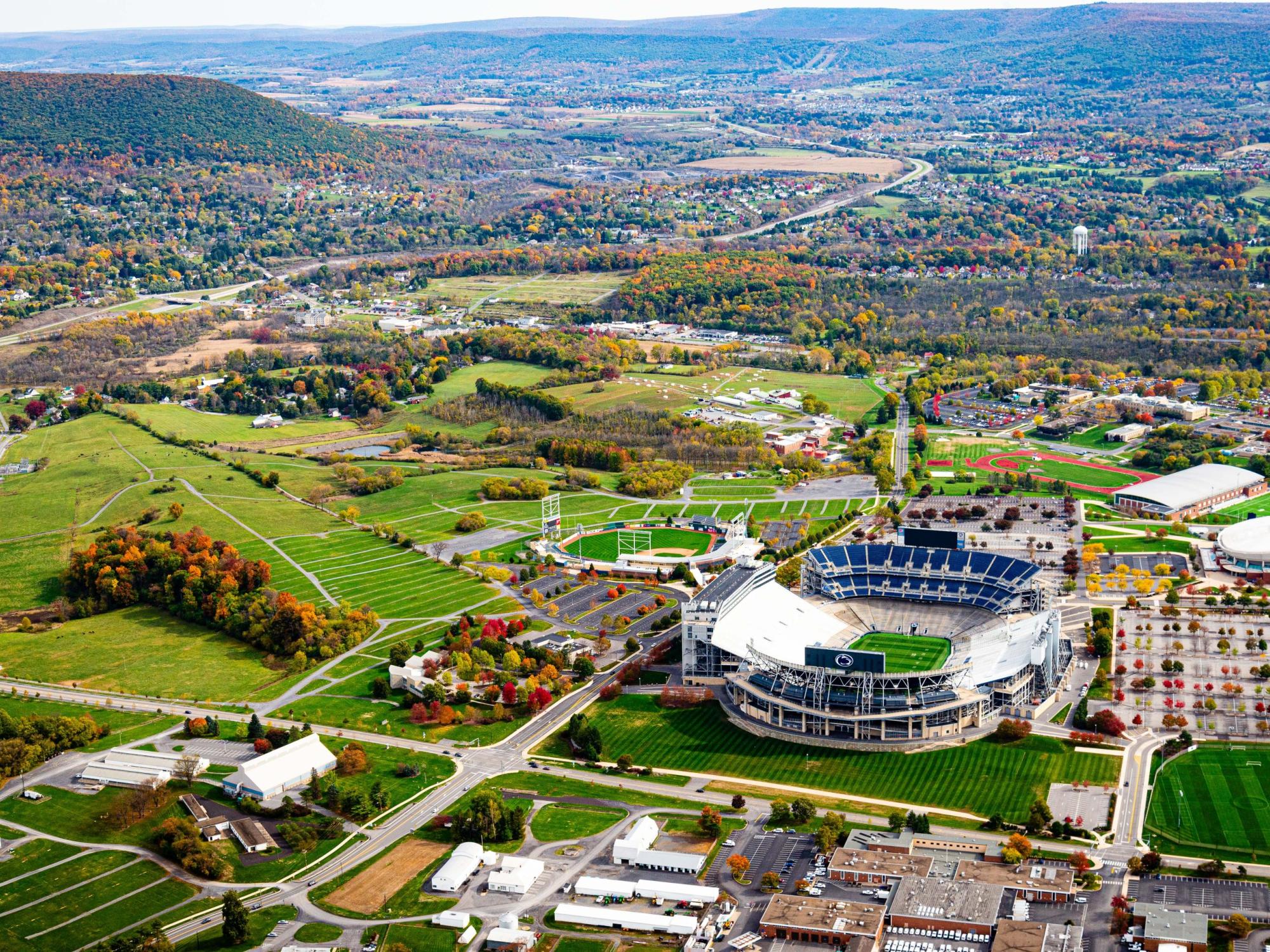 An aerial view of east campus in the fall, with Beaver Stadium in the foreground