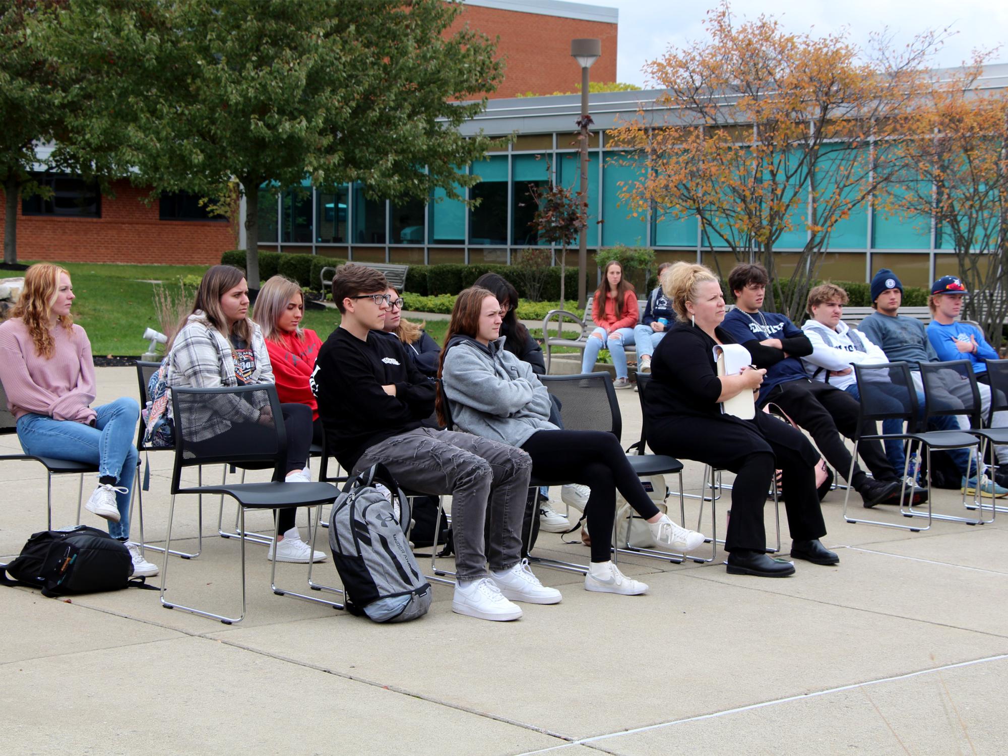 Those in attendance at the victimology event listen and silently reflect upon the testimonials being shared.