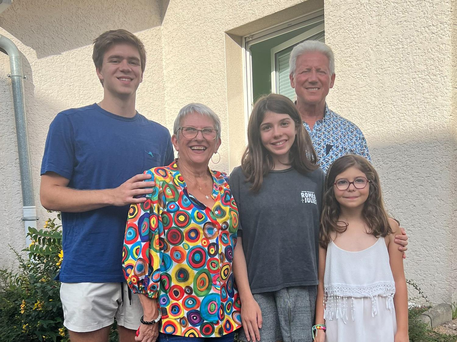 Kenneth Sunnergren poses with his host family, consisting of a host mom, a host dad, and two host sisters.