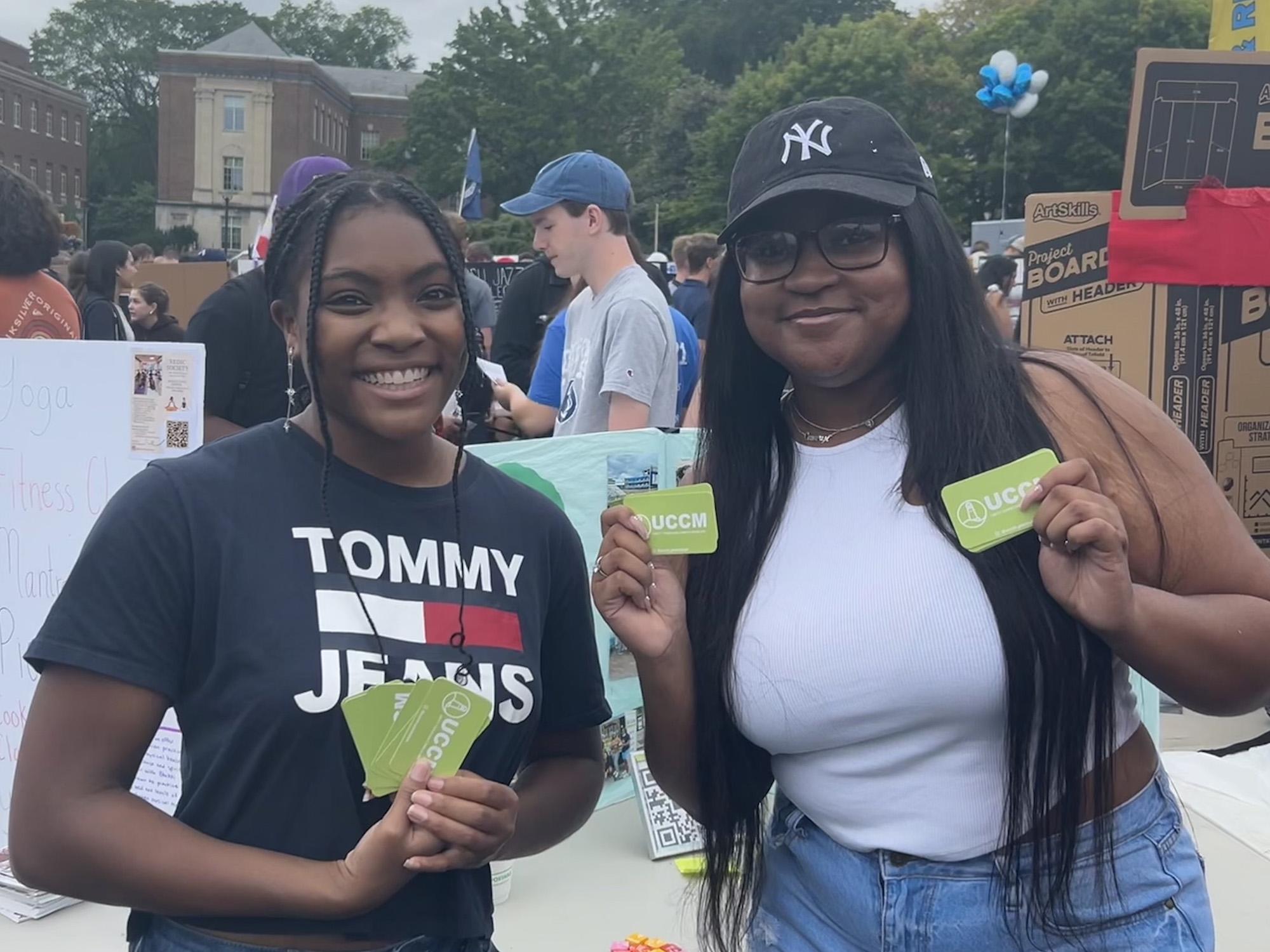 Cameryn Allen (right) and the president of Unity Christian Campus Ministry participate in the Involvement Fair earlier this semester. 