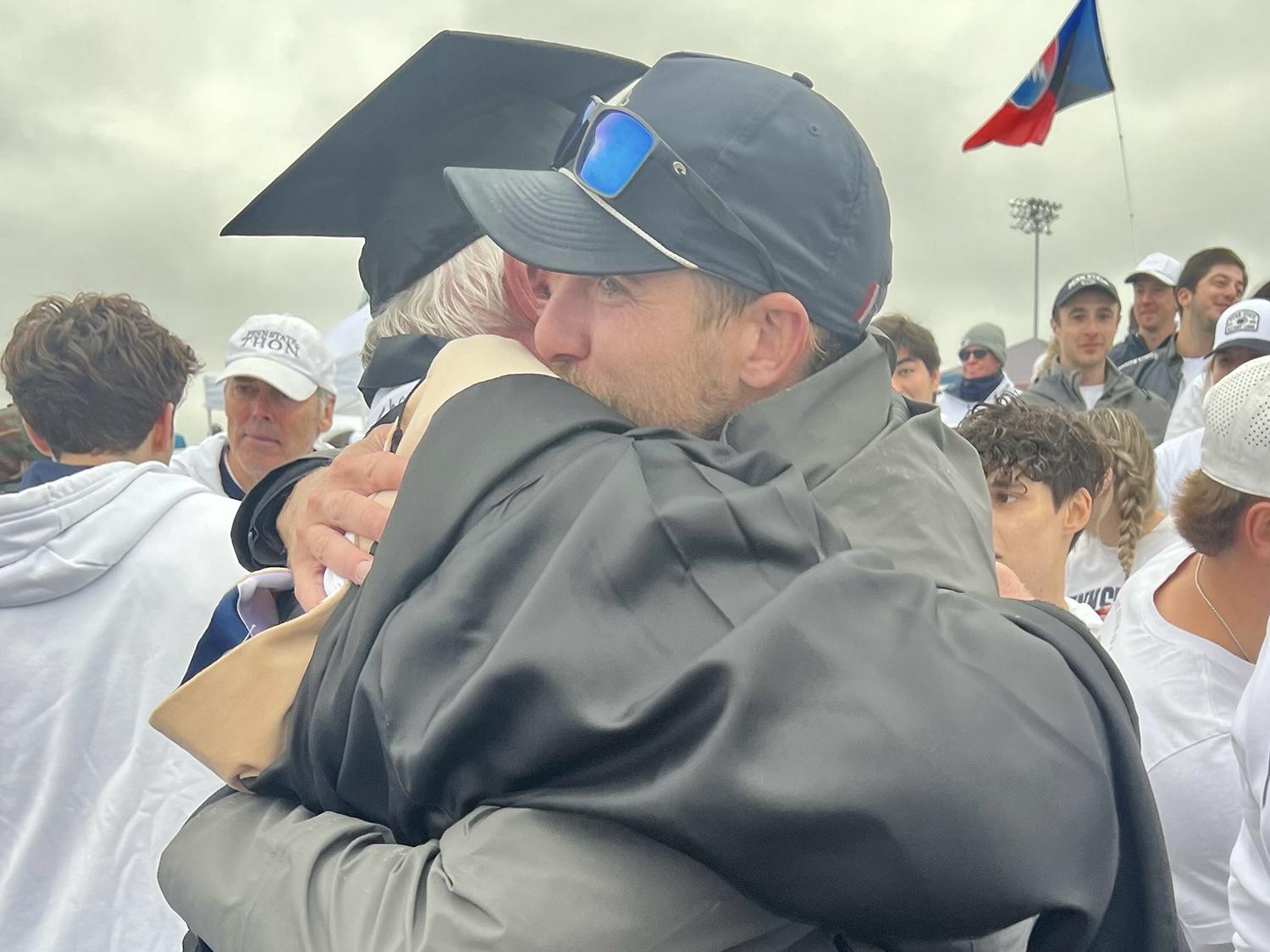 Dale Quayle gets a hug after he revealed that he had earned a Penn State Smeal master's degree.