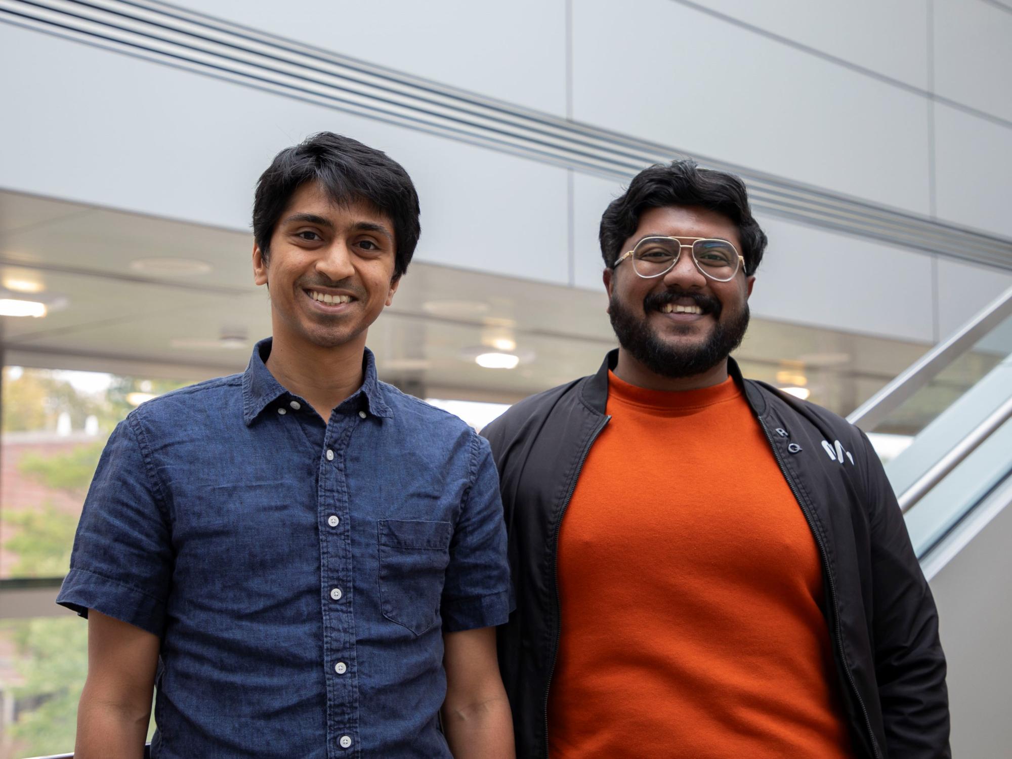 two smiling people in casual attire