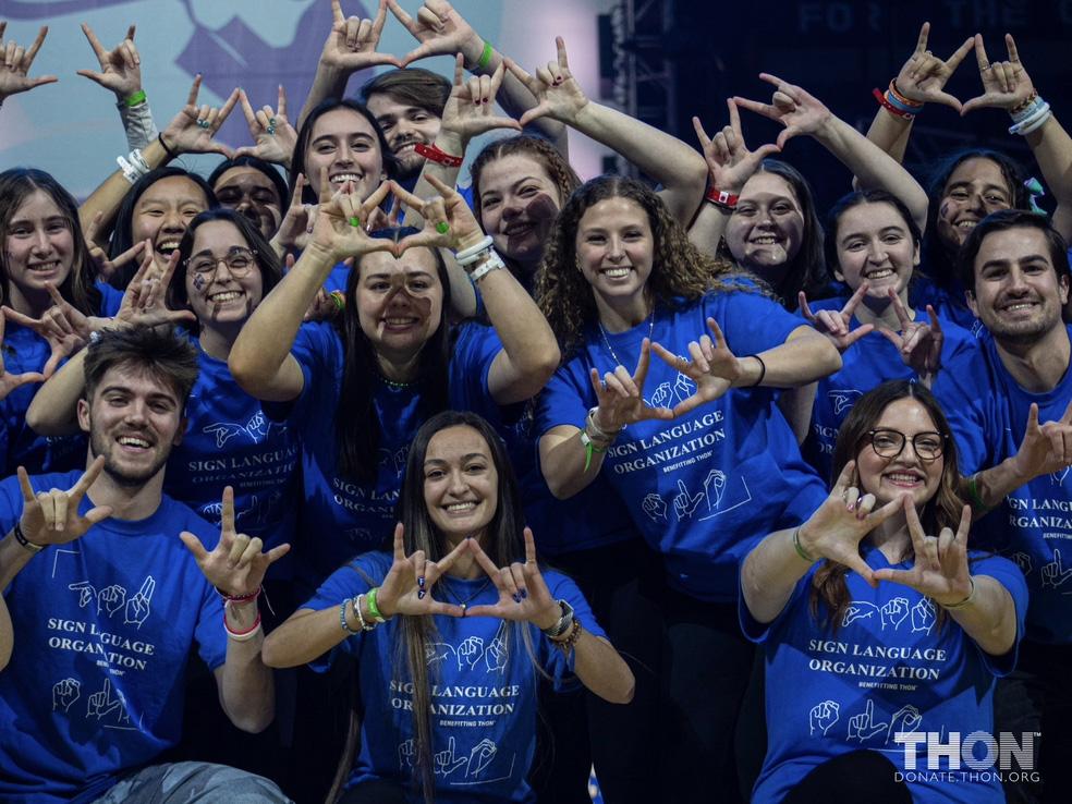 A group of people in blue shirts 