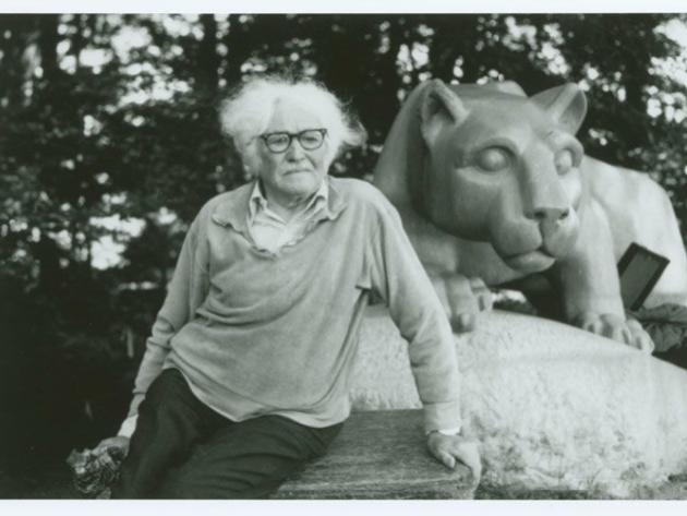 Heinz Warneke sits in front of the Nittany Lion Shrine