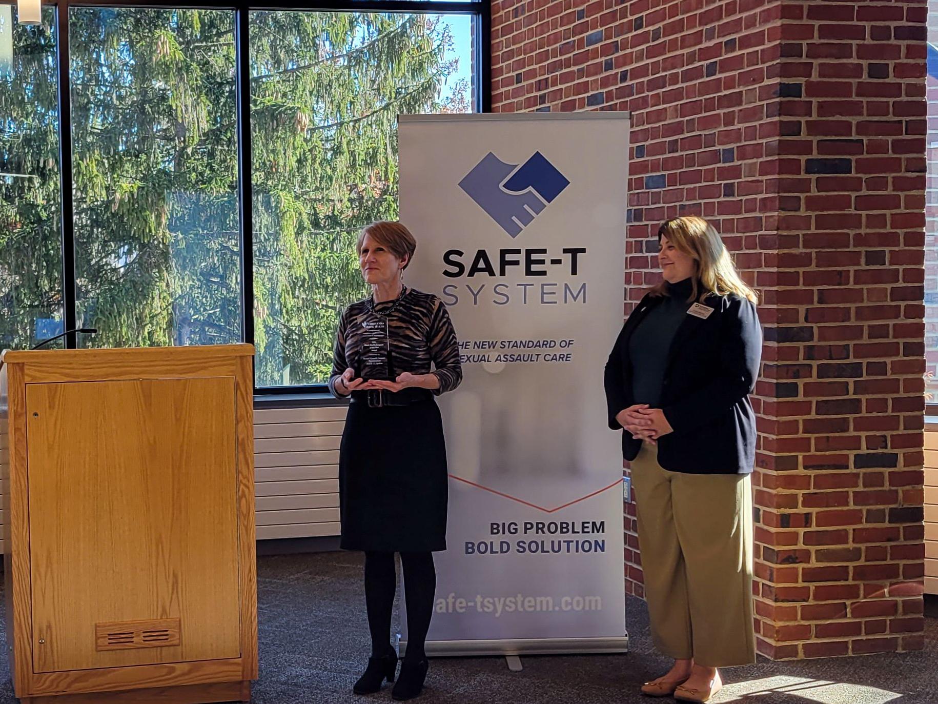 Lisa Davis presents the award for Rural Health Program of the Year to Cynthia Bittner.