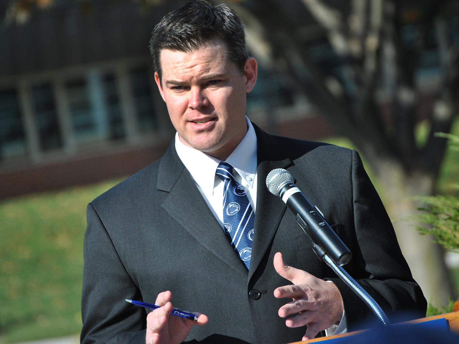 Dave Hartman speaks at a Veterans Day ceremony