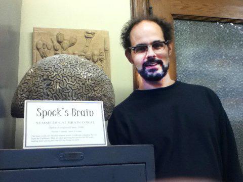 Joseph Polizzi poses with a piece of symmetrical coral known as "Spock's Brain."