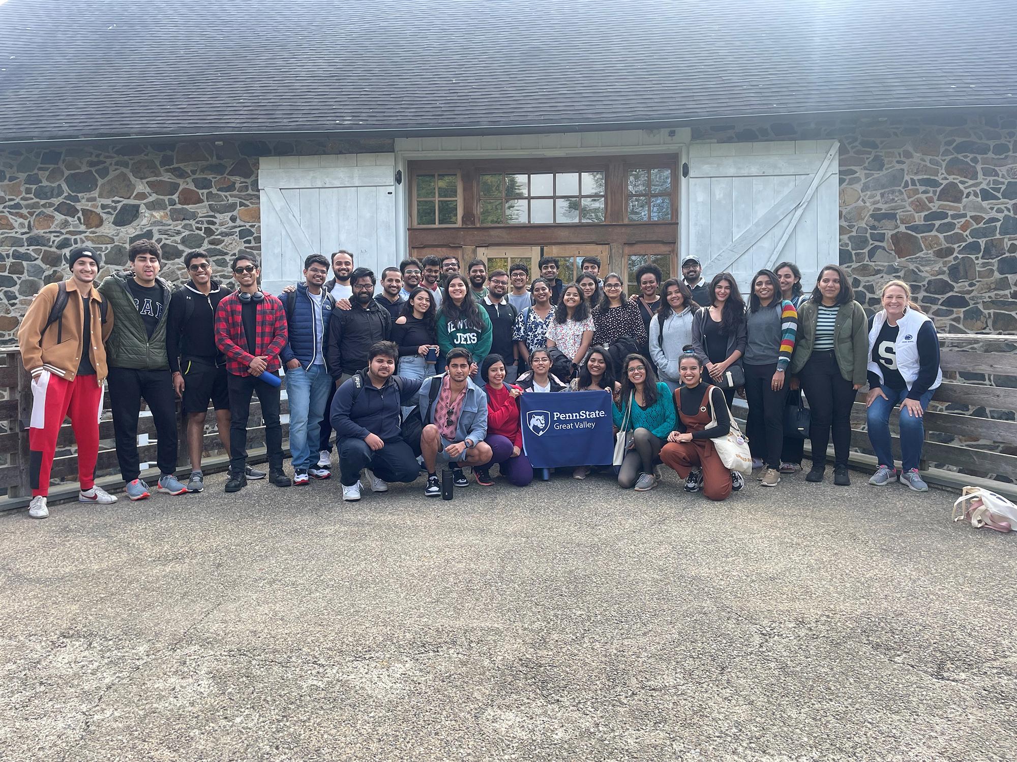 A large group of students standing outside the Tyler Arboretum