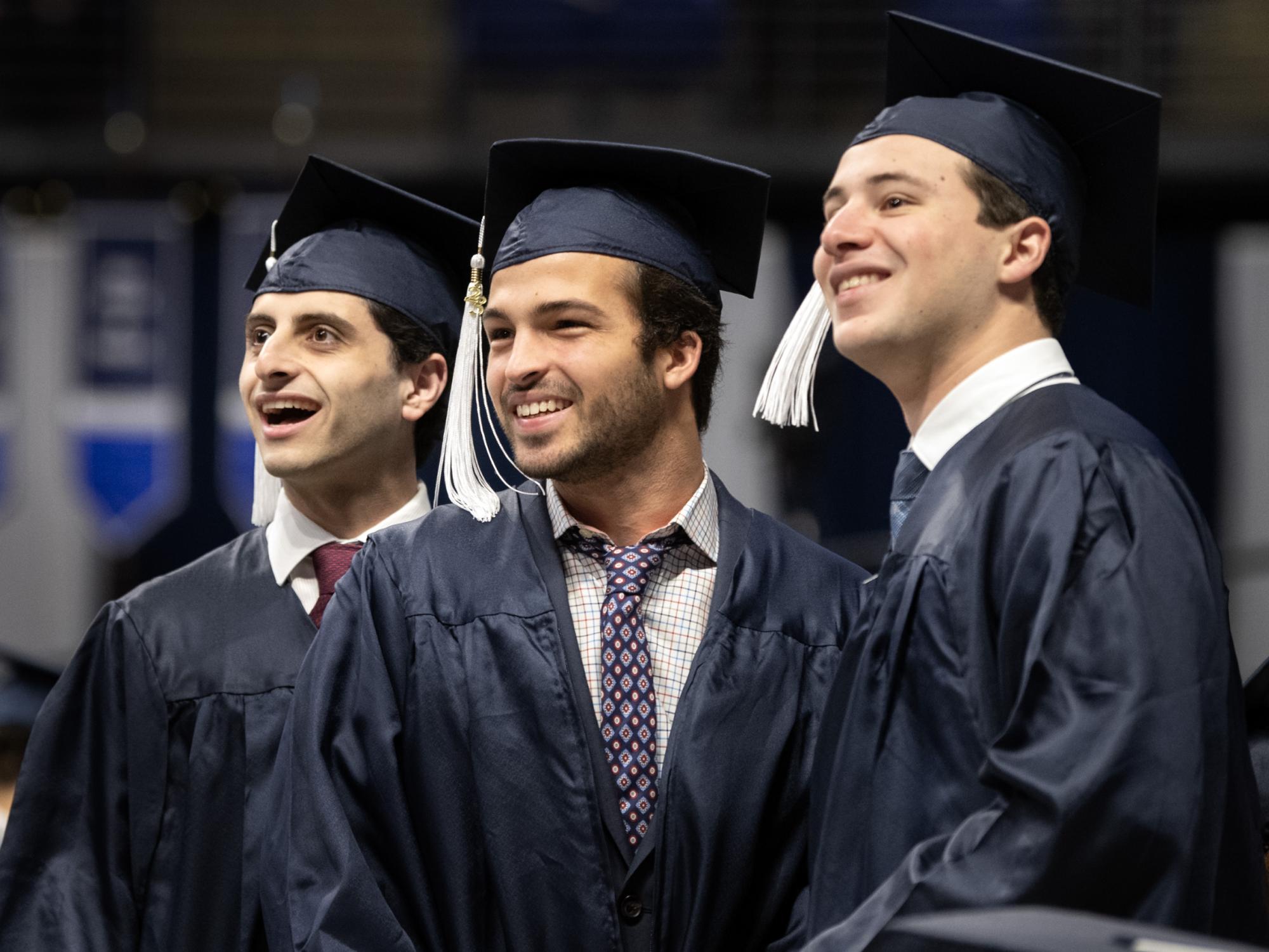 graduates smiling