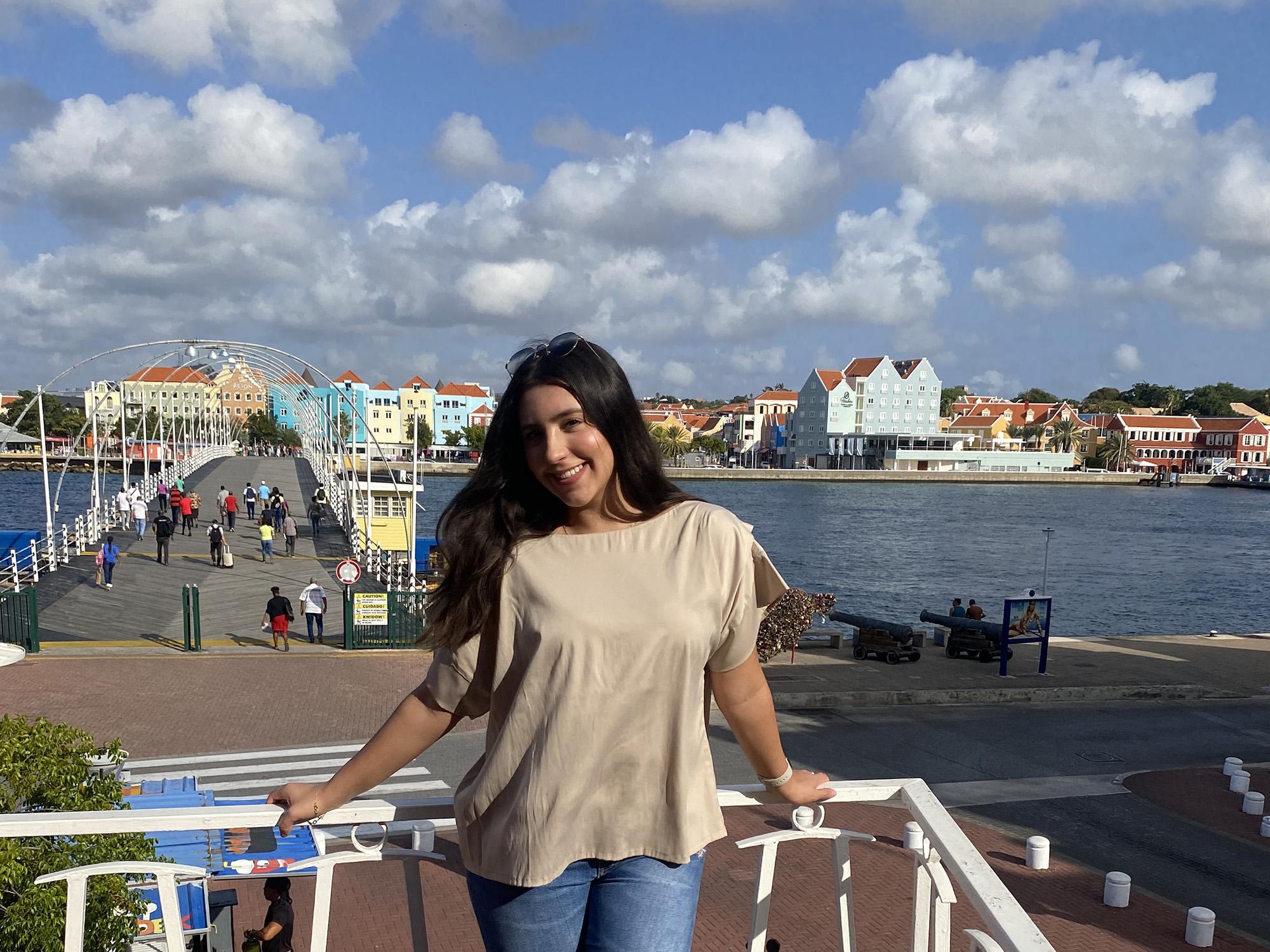 Nina Castillo Schoonewolff stands in Willemstad, Curaçao, during an embedded course trip in March 2023.