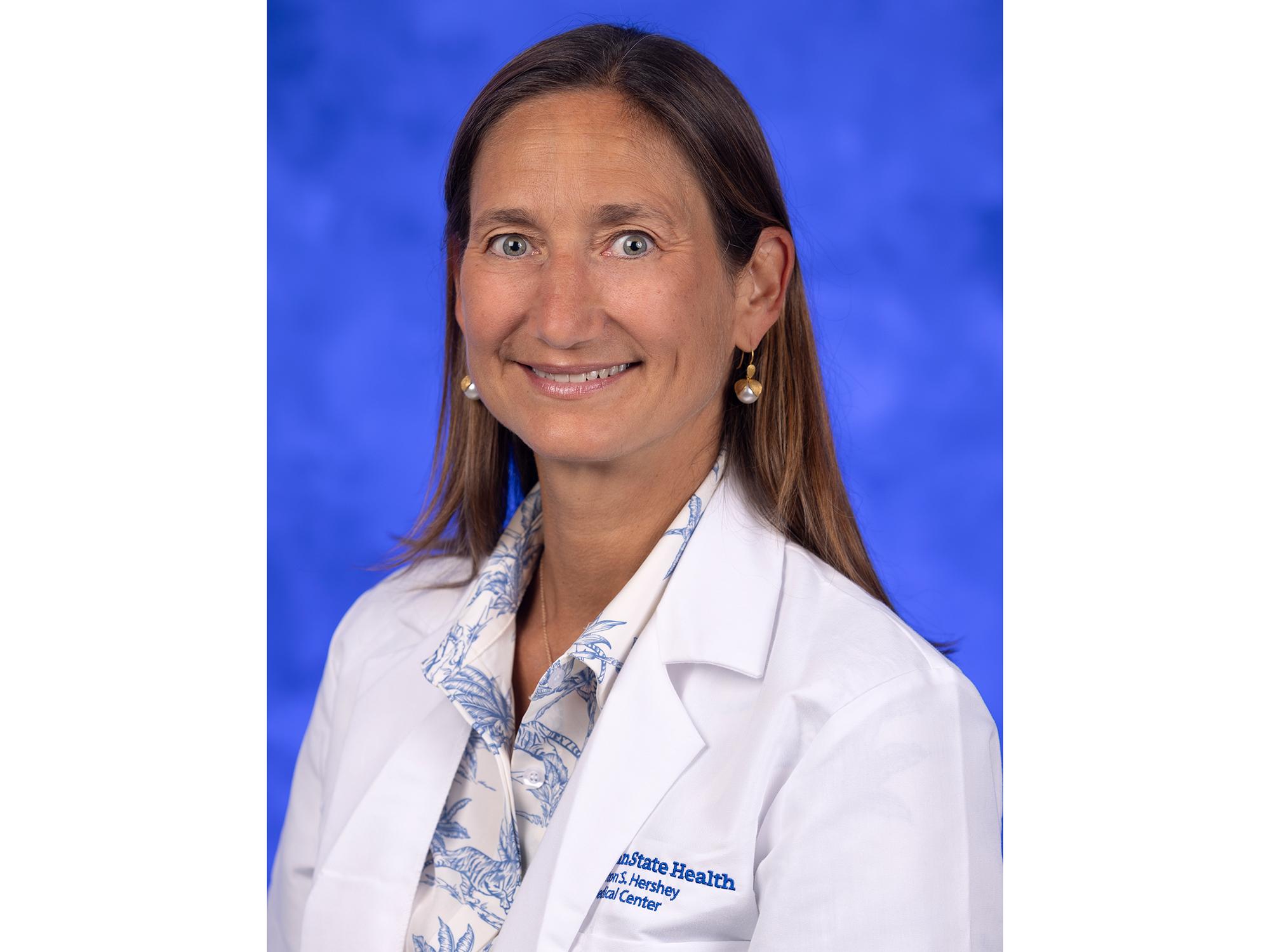 Portrait of a person in a white coat
