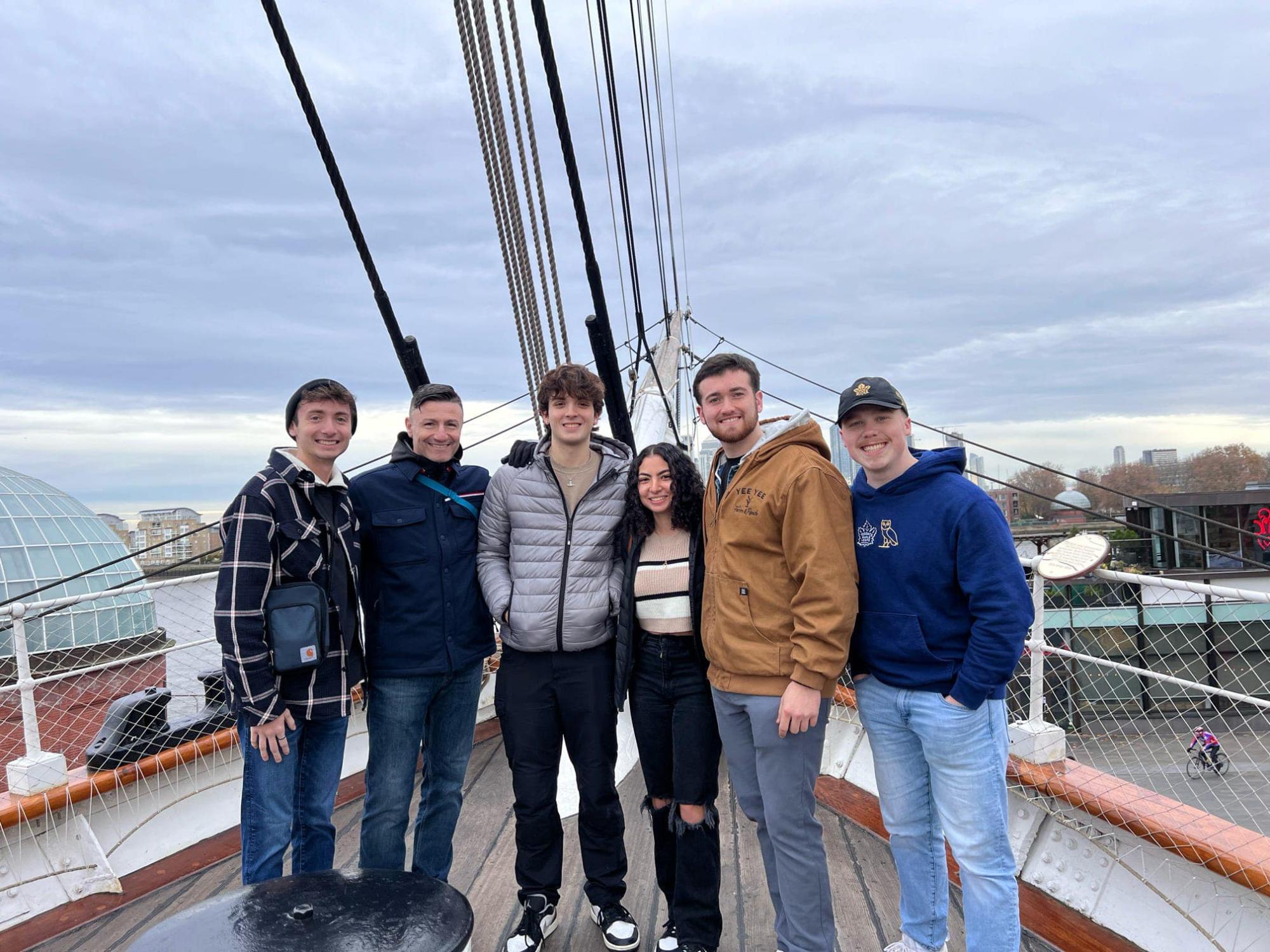 Students of the course CRIMJ 499: Serial Killers and European Criminal Justice posing on a British cargo ship.