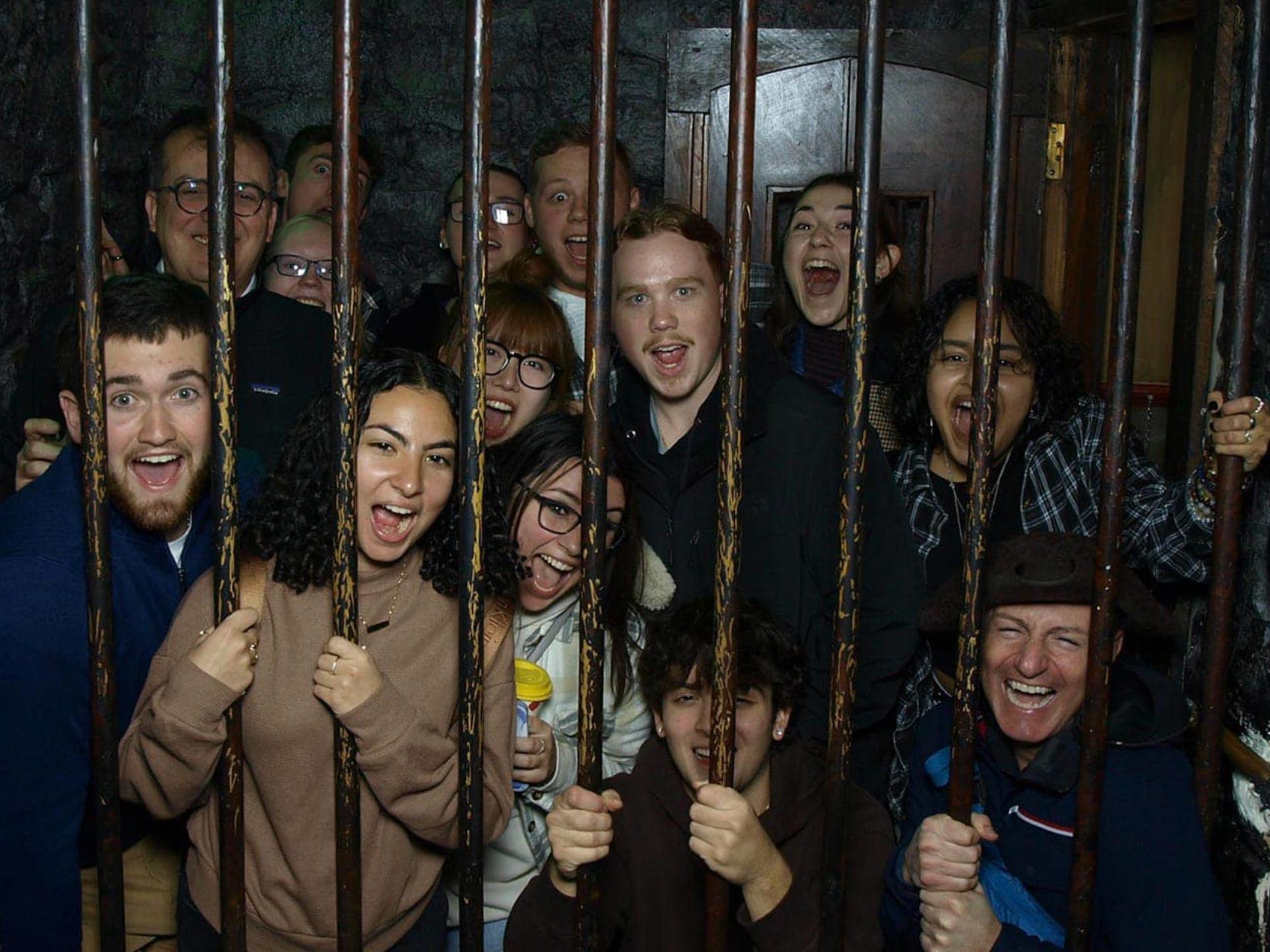 Students of the course CRIMJ 499: Serial Killers and European Criminal Justice posing at the Clink Jail.