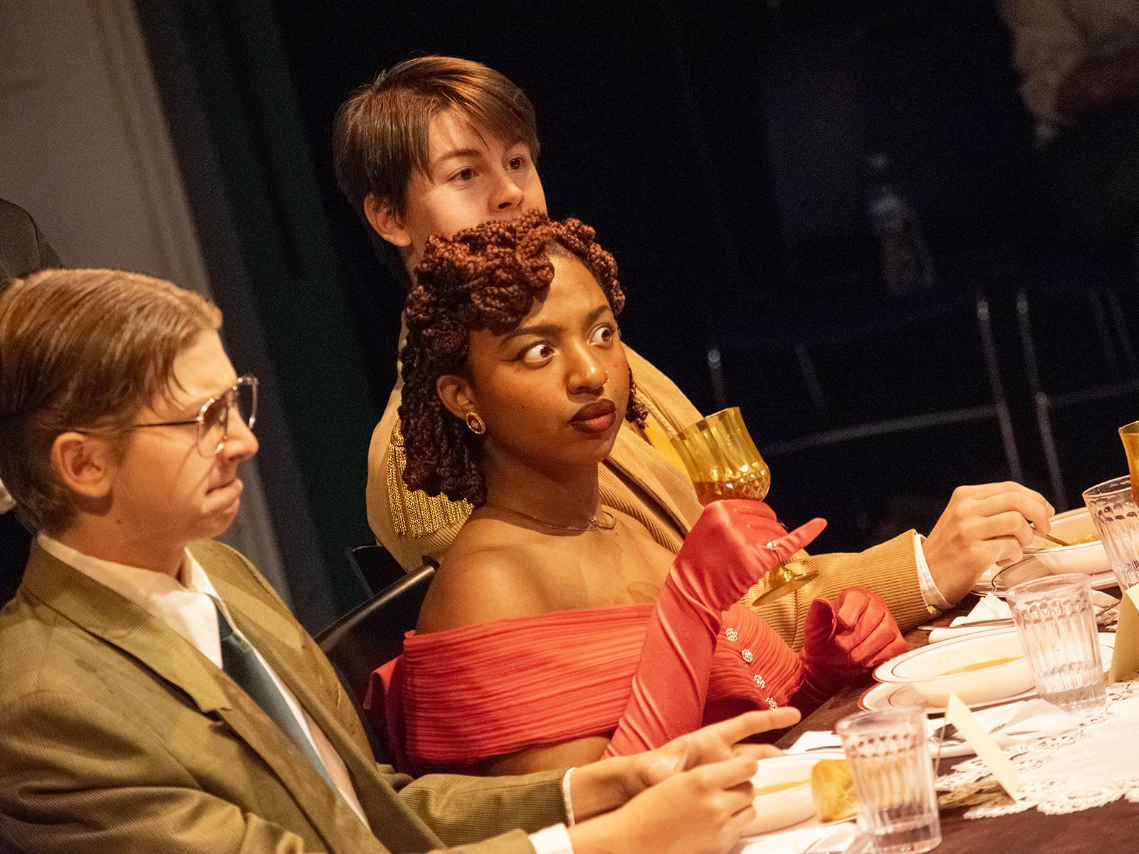 Penn State Harrisburg students perform a scene in "Clue" around a dining table
