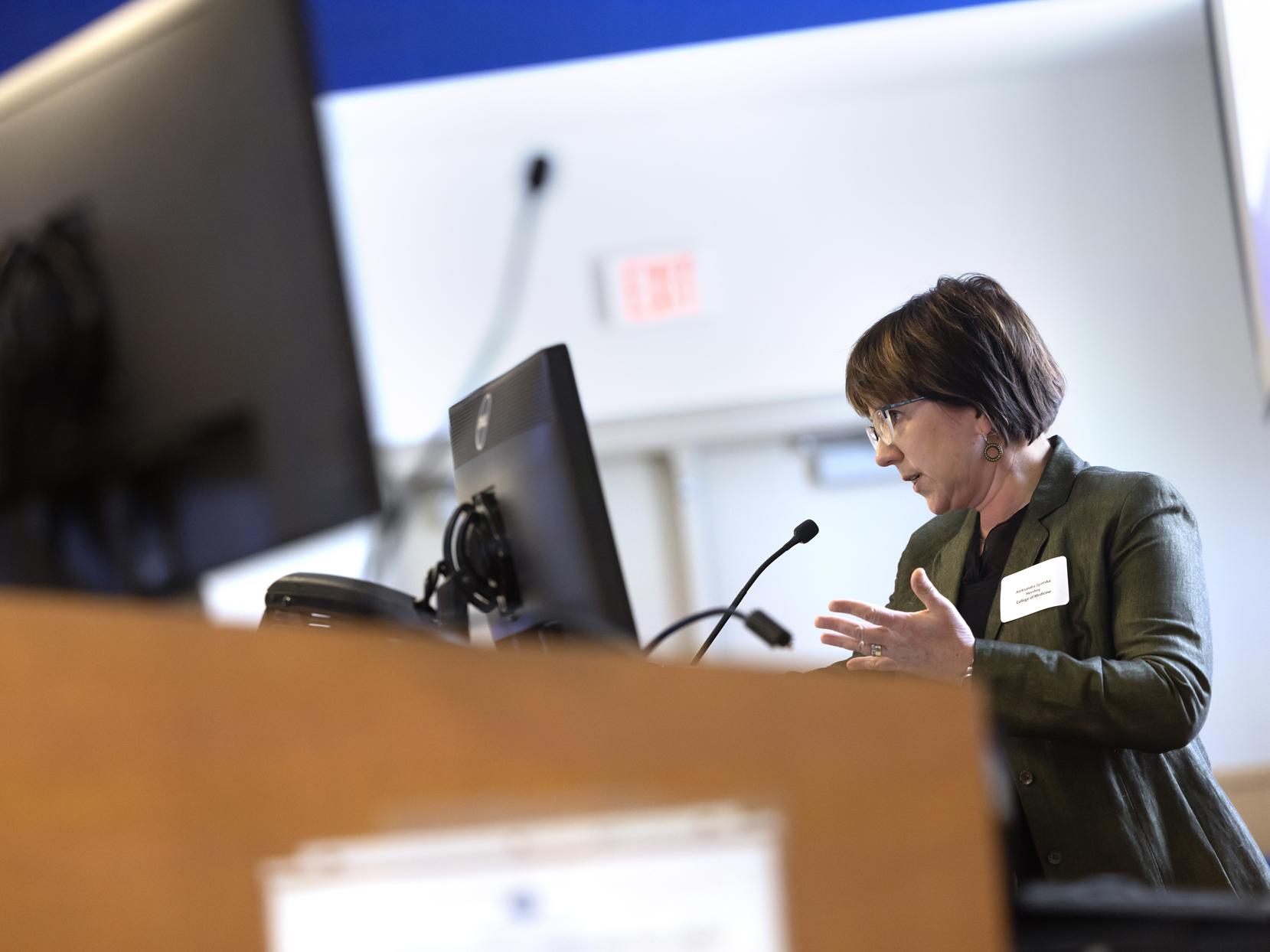 Dr. Aleksandra Zgierska stands at podium