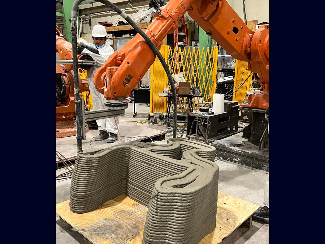 A concrete structure being 3D printed in the Additive Construction Lab.