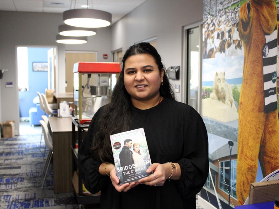 Assistant Director of Student Services and Engagement Dharti Ray poses with her chosen VD