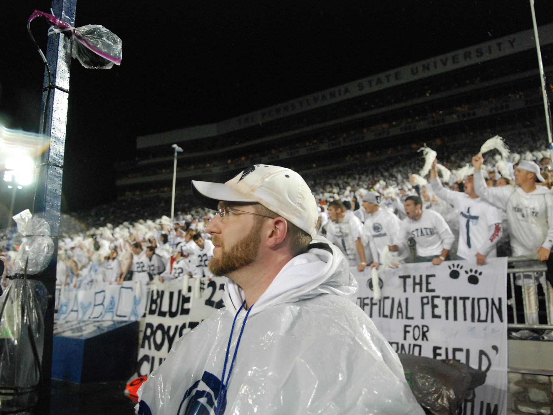 Barnard measures crowd noise in 2009 at the Penn State v. Iowa game using a high precision sound level meter.
