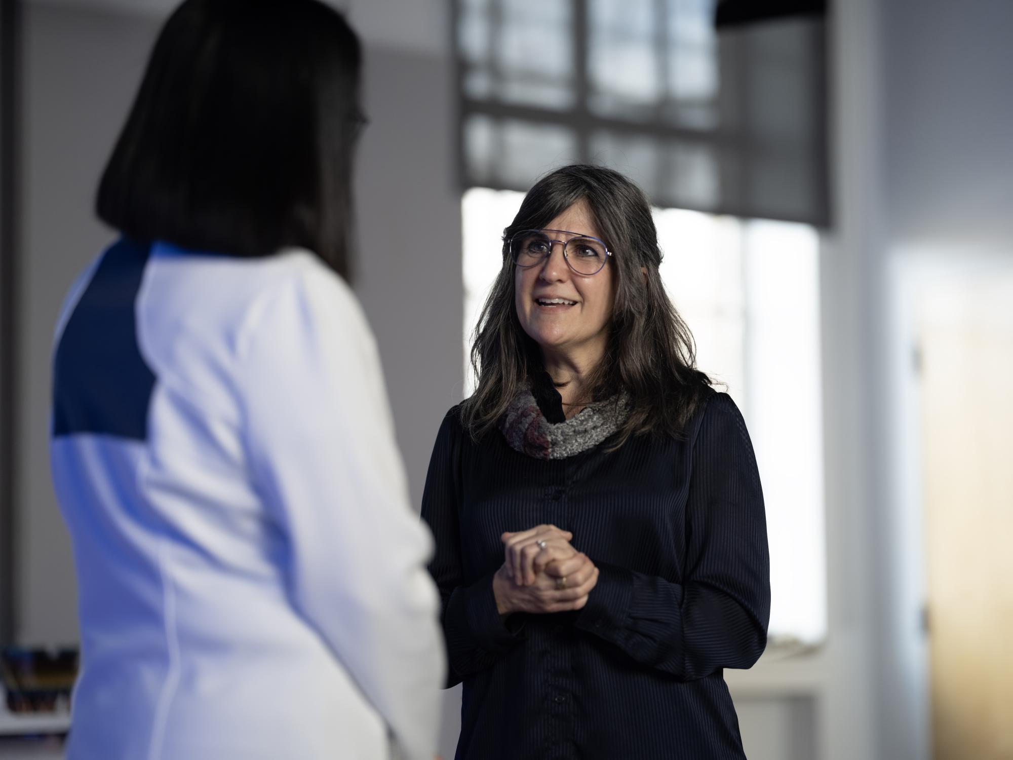 Bonnie discusses the “Together, Tacit” with Neeli in the C-PAD Lab.