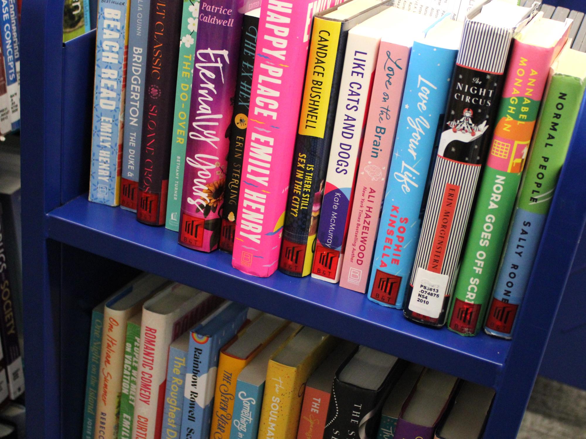The February Library Cart stocked with romance-themed books and DVDs