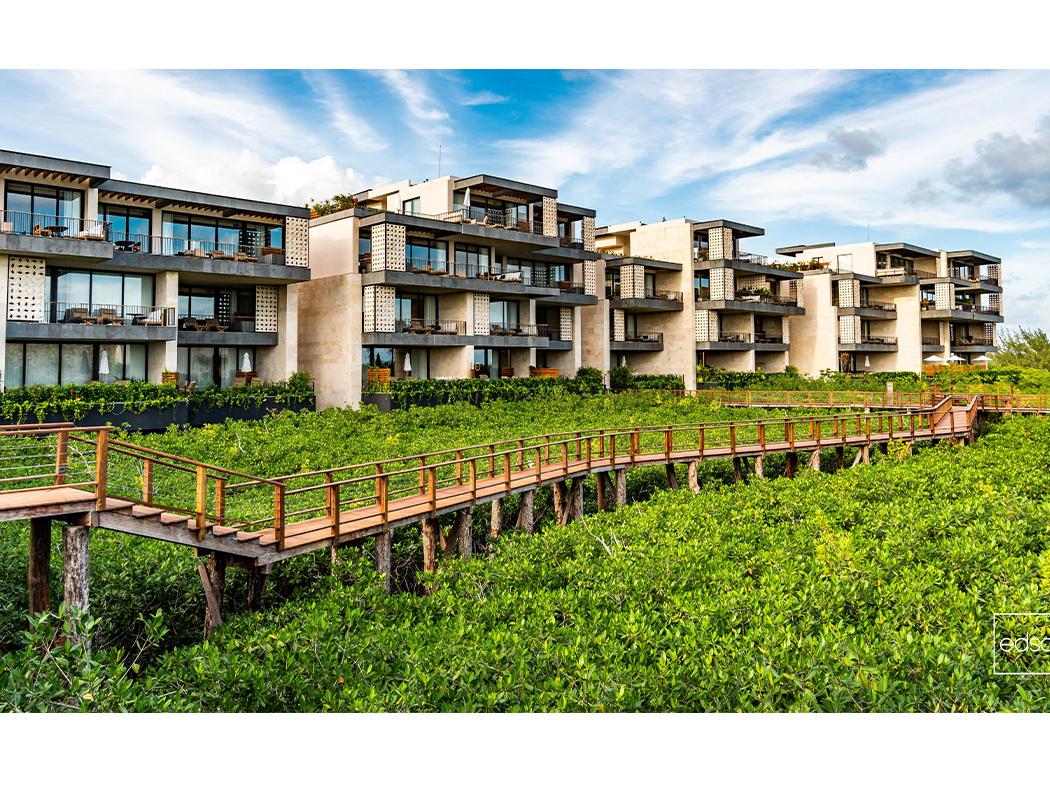 A rendering of a housing community amongst a designed landscape. 