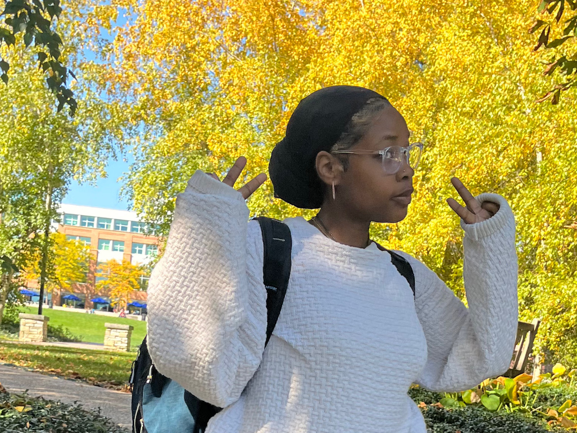 Nije’e Patton-Johns wears a backpack while standing near the lawn of the HUB-Robeson Center.