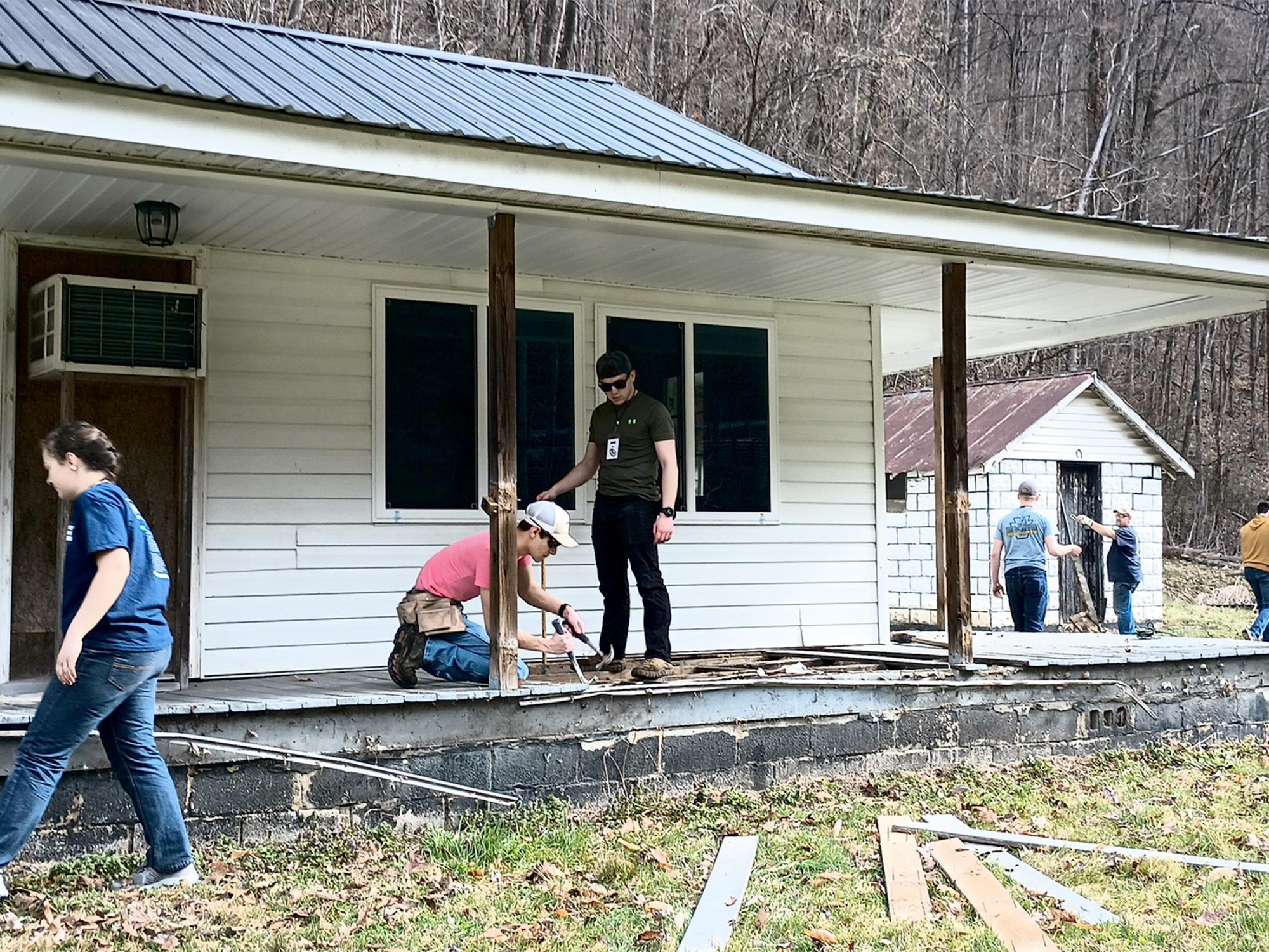 Students from the Christian Student Fellowship organization at Penn State DuBois work through a demolition project during their spring break service trip to Kentucky.