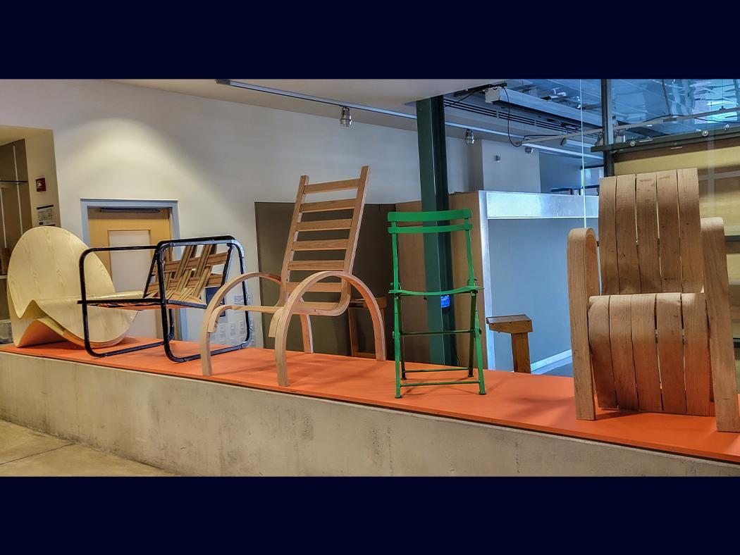 Chairs align part of a wall in the Stuckeman Family Building. 