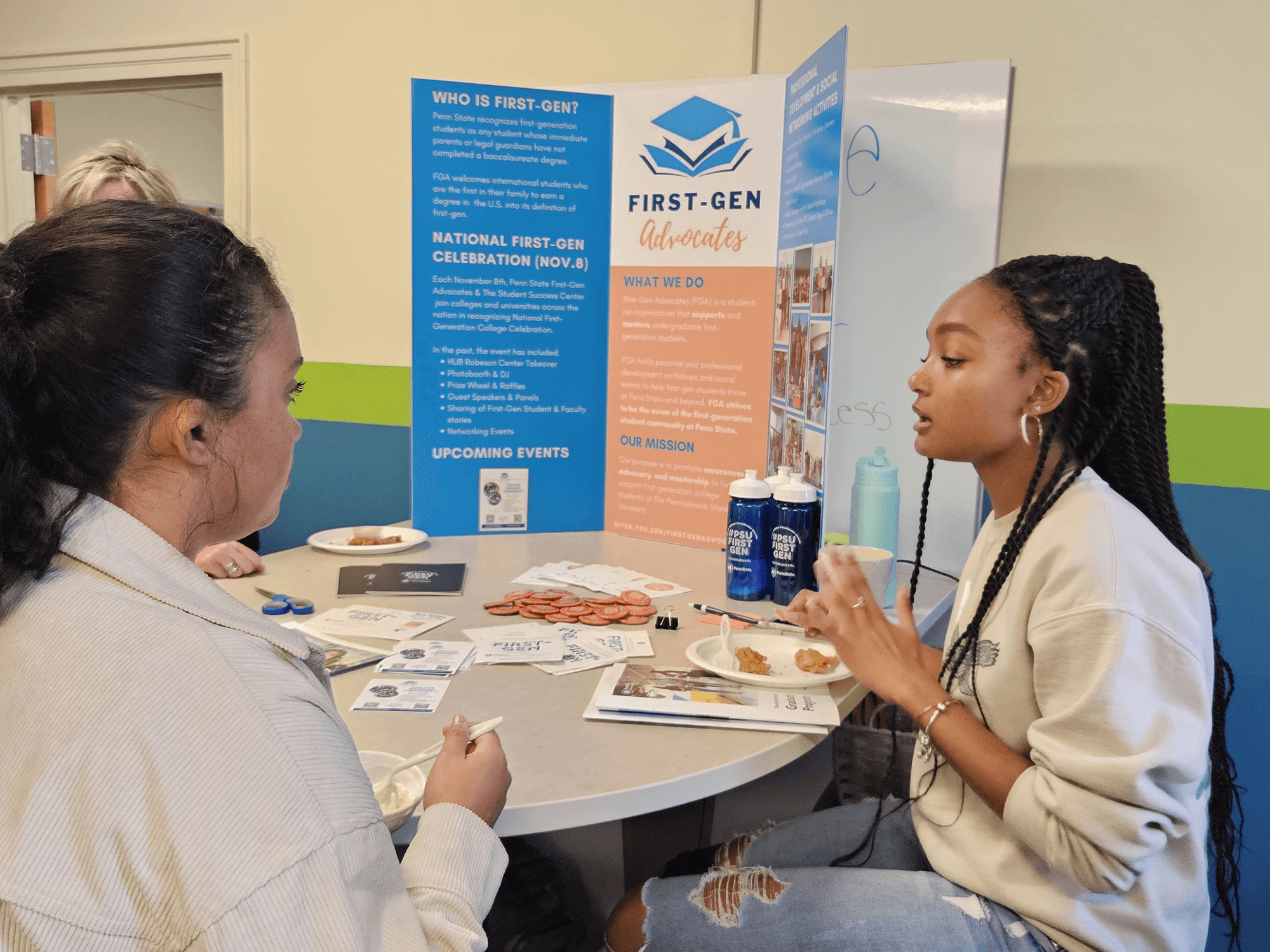 Milan Dukes (right) talks to student Janet Rivera (left) about First-Gen Advocates at a First-Generation Committee Meet and Greet on September 14, 2023.