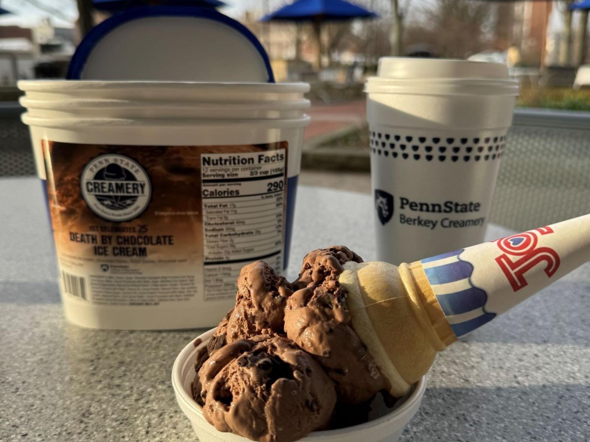 ice cream container and cone on picnic table