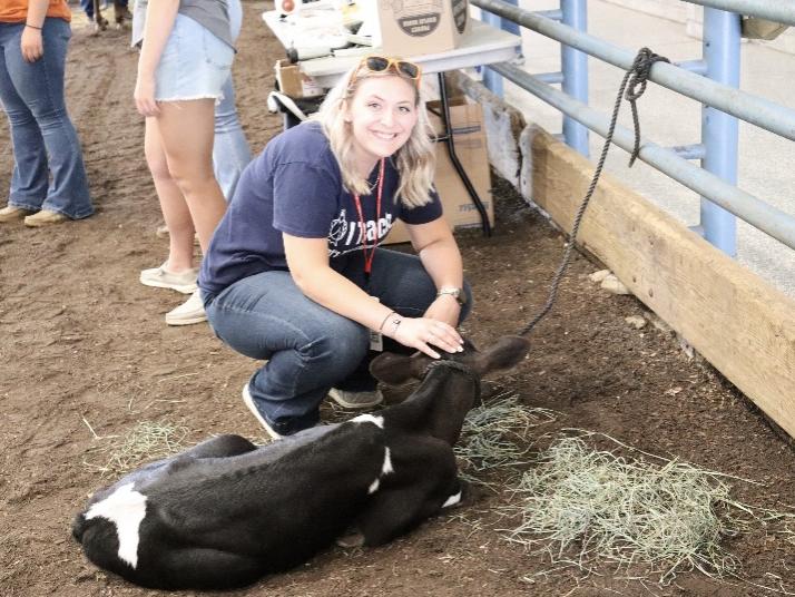 Cheyenne Bastian-Brown with a baby cow
