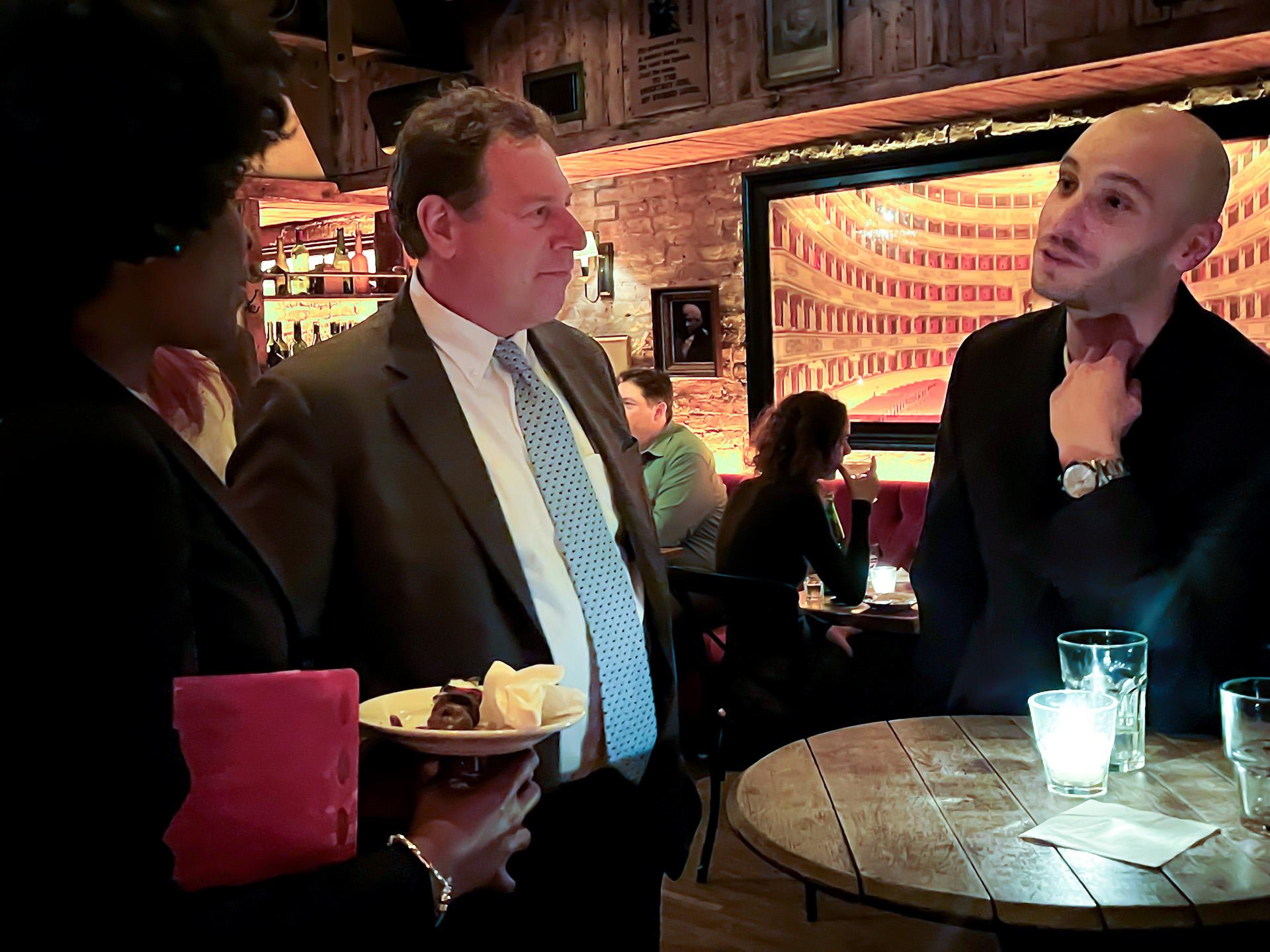 SIA Director Mitchell Smith speaking with alumnus Alfredo Malaret Baldo at the alumni reception in New York City.